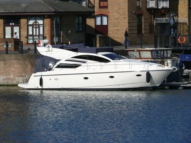 Song and Dance, a white flybridge motor yacht, moored alongside